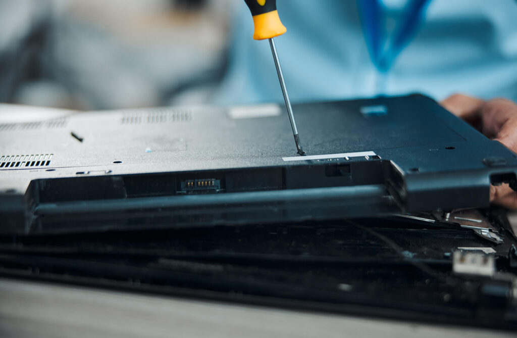 technician repairing laptop at Gadgets & Gold in Canada